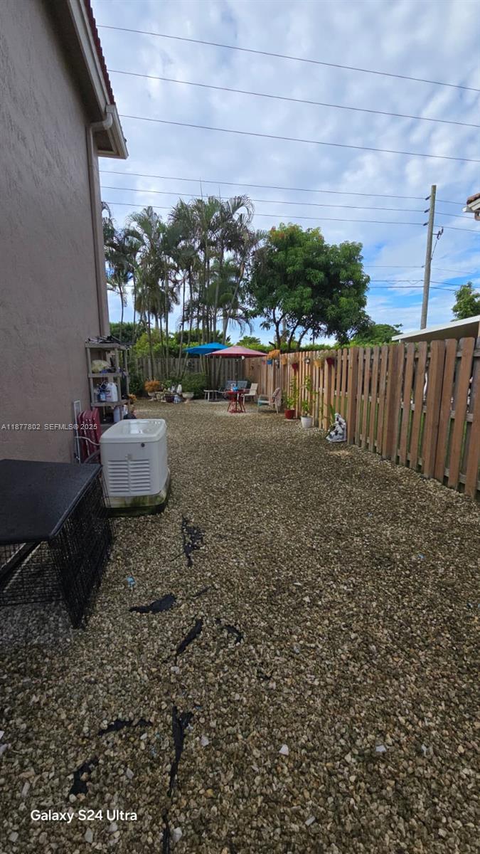 15436 Southwest 151st Terrace Miami, FL 33196 - Photo 37 of 50 a view of swimming pool with a yard