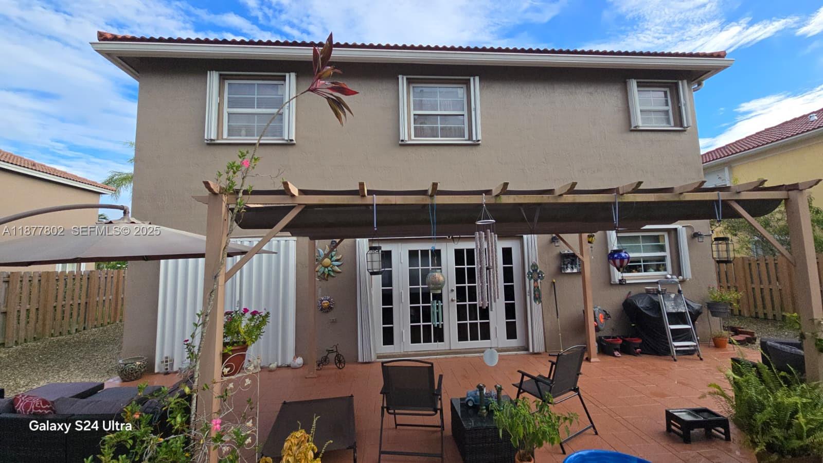 15436 Southwest 151st Terrace Miami, FL 33196 - Photo 43 of 50 a front view of a house with balcony