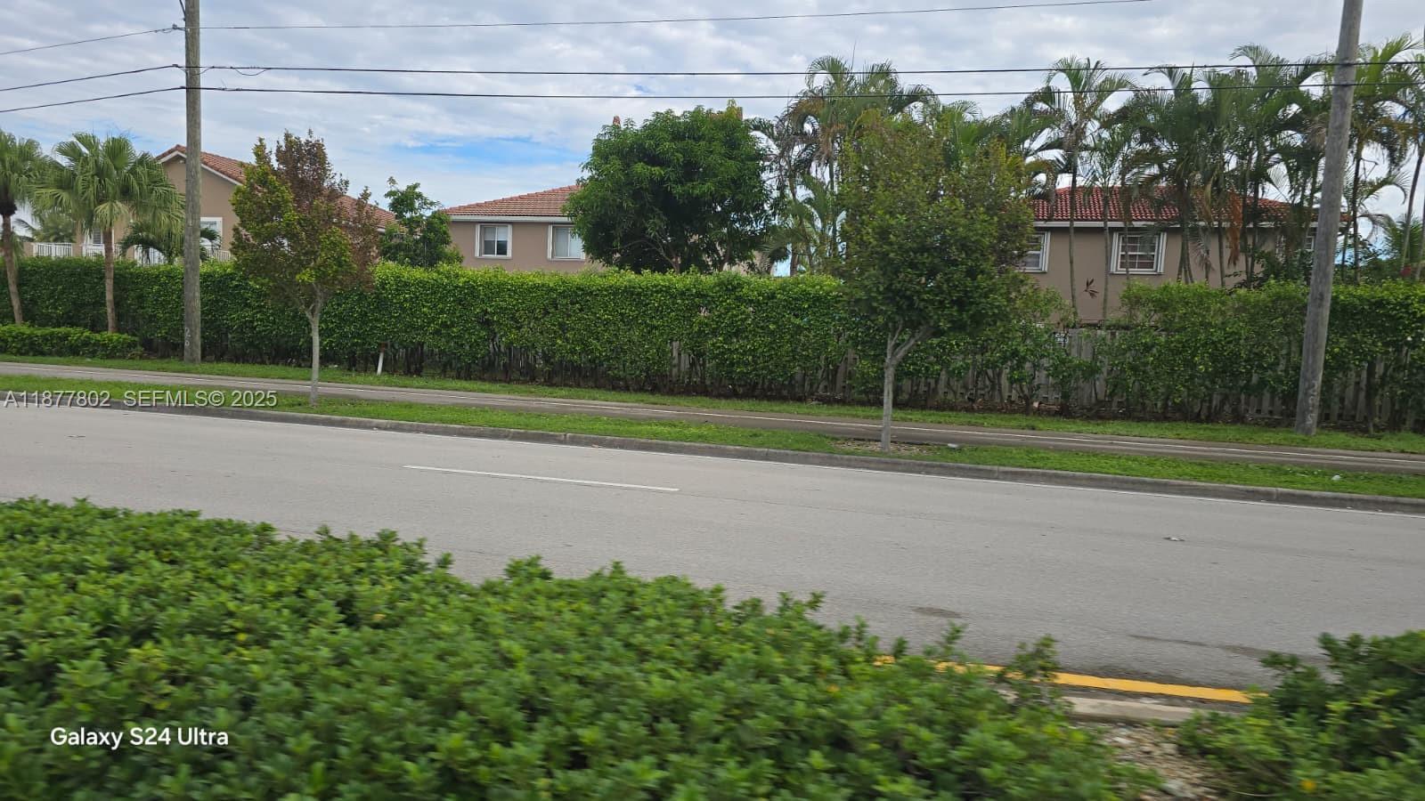 15436 Southwest 151st Terrace Miami, FL 33196 - Photo 49 of 50 a view of a house with a big yard and potted plants