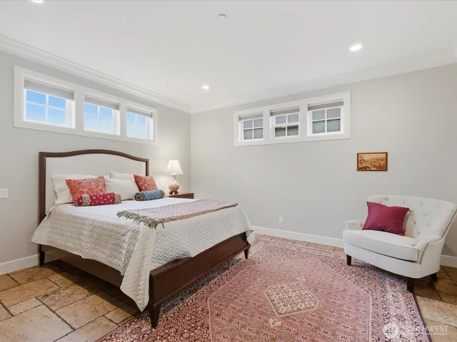 a bedroom with a bed and a couch