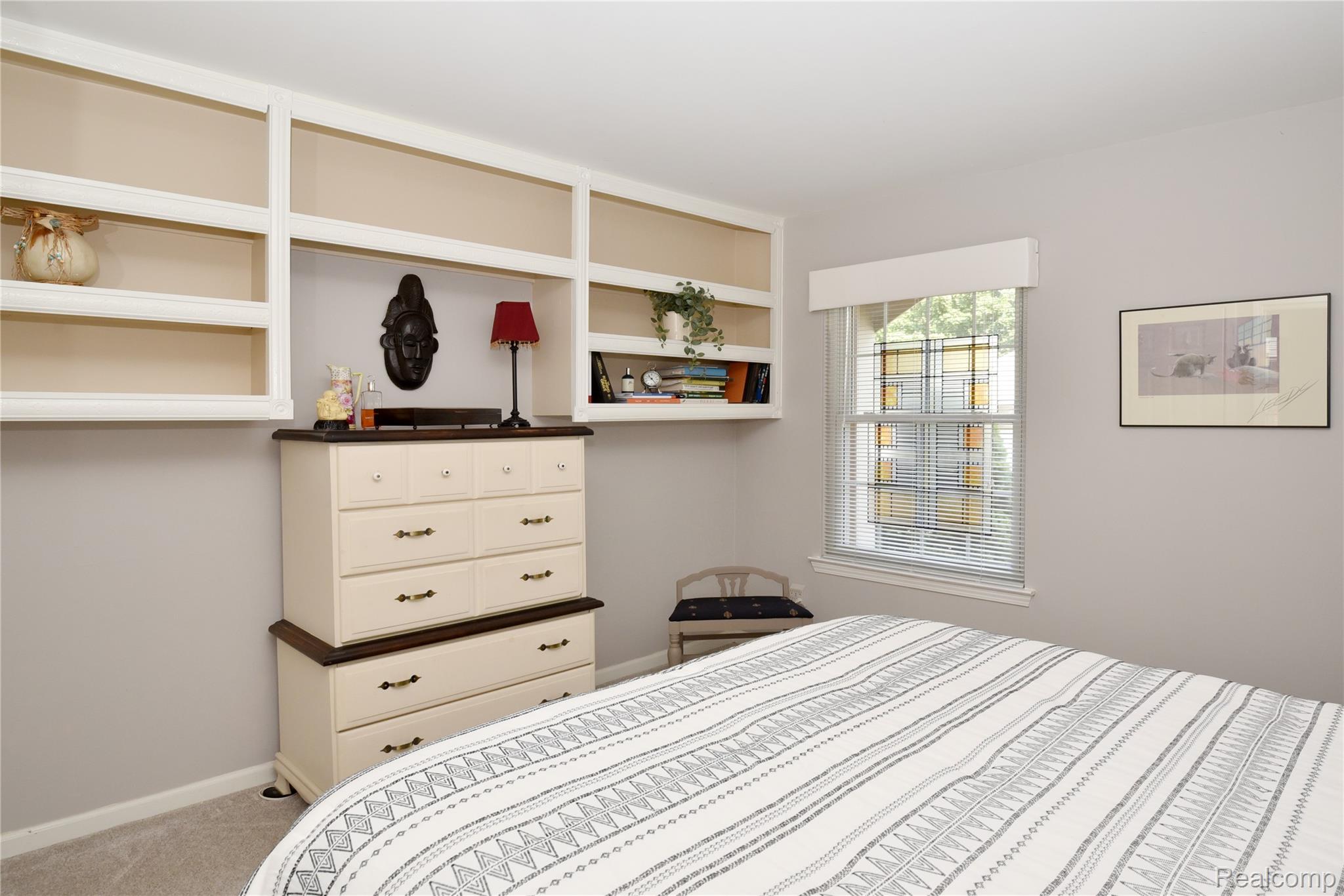 1635 Huntington Park, Unit A Rochester, MI 48309 - Photo 24 of 41 2nd Bedroom - Tasteful Build-Ins