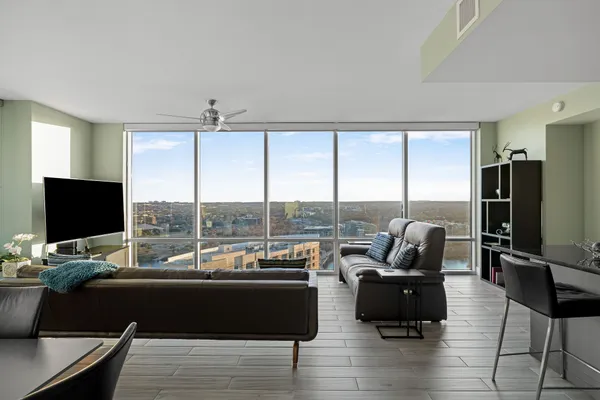 a living room with couch and large flat screen tv