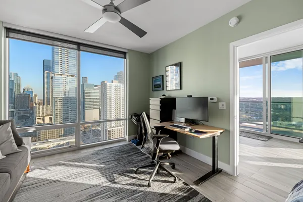 a workspace with furniture and a window