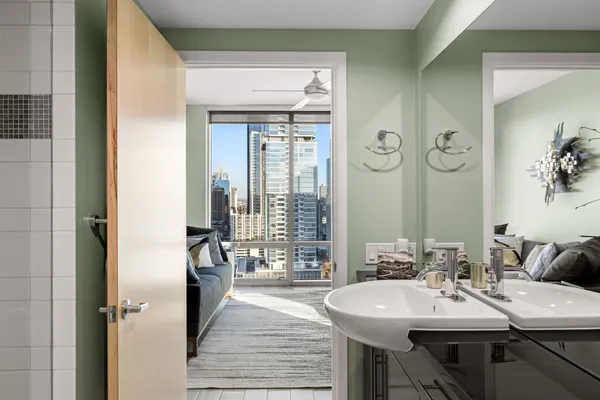 a view of a bathroom with a sink and mirror