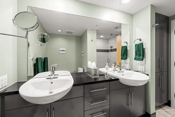 a bathroom with a sink double vanity and a mirror