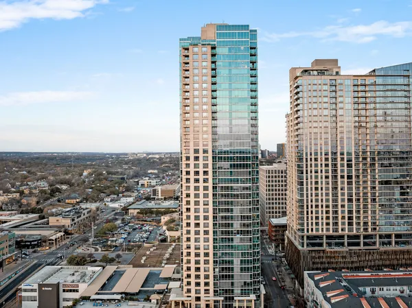 a view of a city with tall buildings