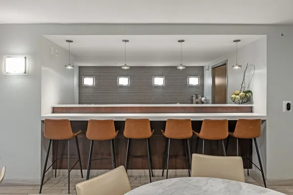 a bathroom with a dining table and chairs