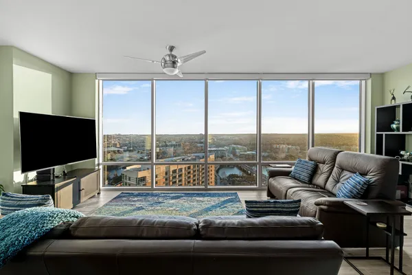 a living room with furniture and a flat screen tv