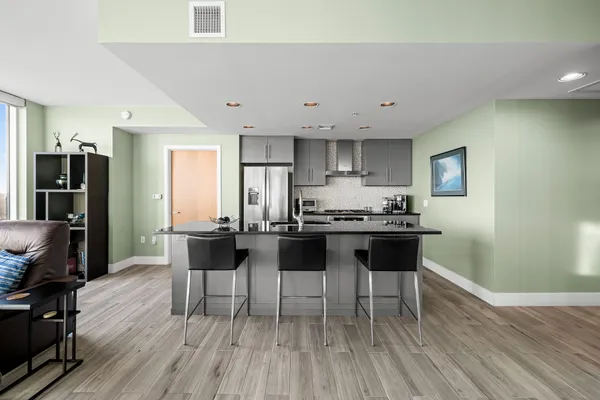a kitchen with a table and chairs in it
