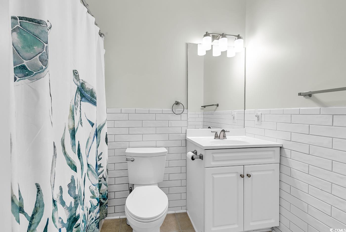 300 Kiskadee Loop, Unit K Conway, SC 29526 - Photo 13 of 40 Full bathroom featuring tile walls, vanity, wainsc
