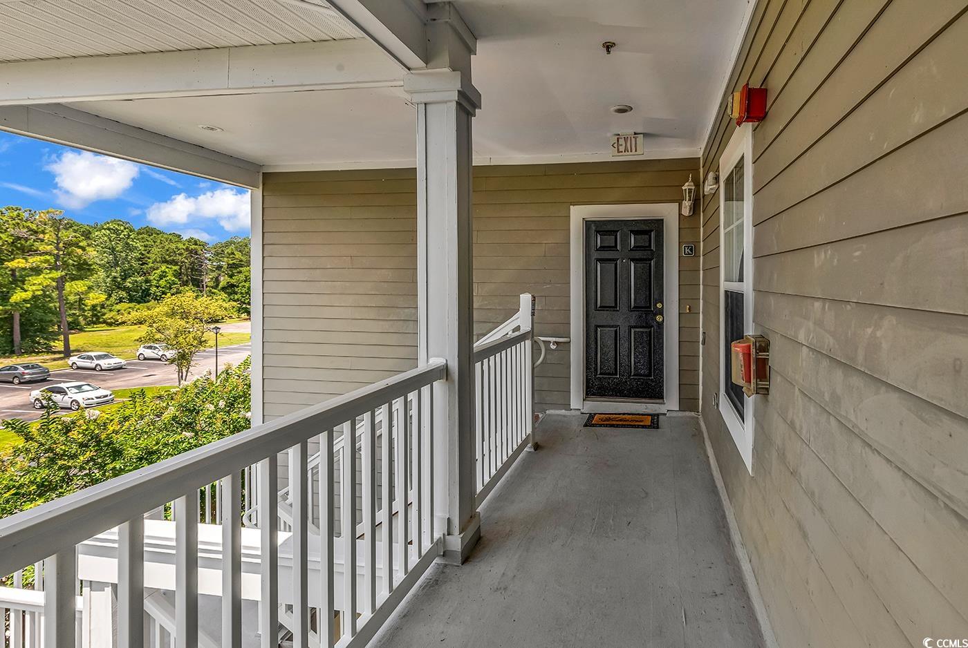 300 Kiskadee Loop, Unit K Conway, SC 29526 - Photo 25 of 40 Doorway to property featuring a porch
