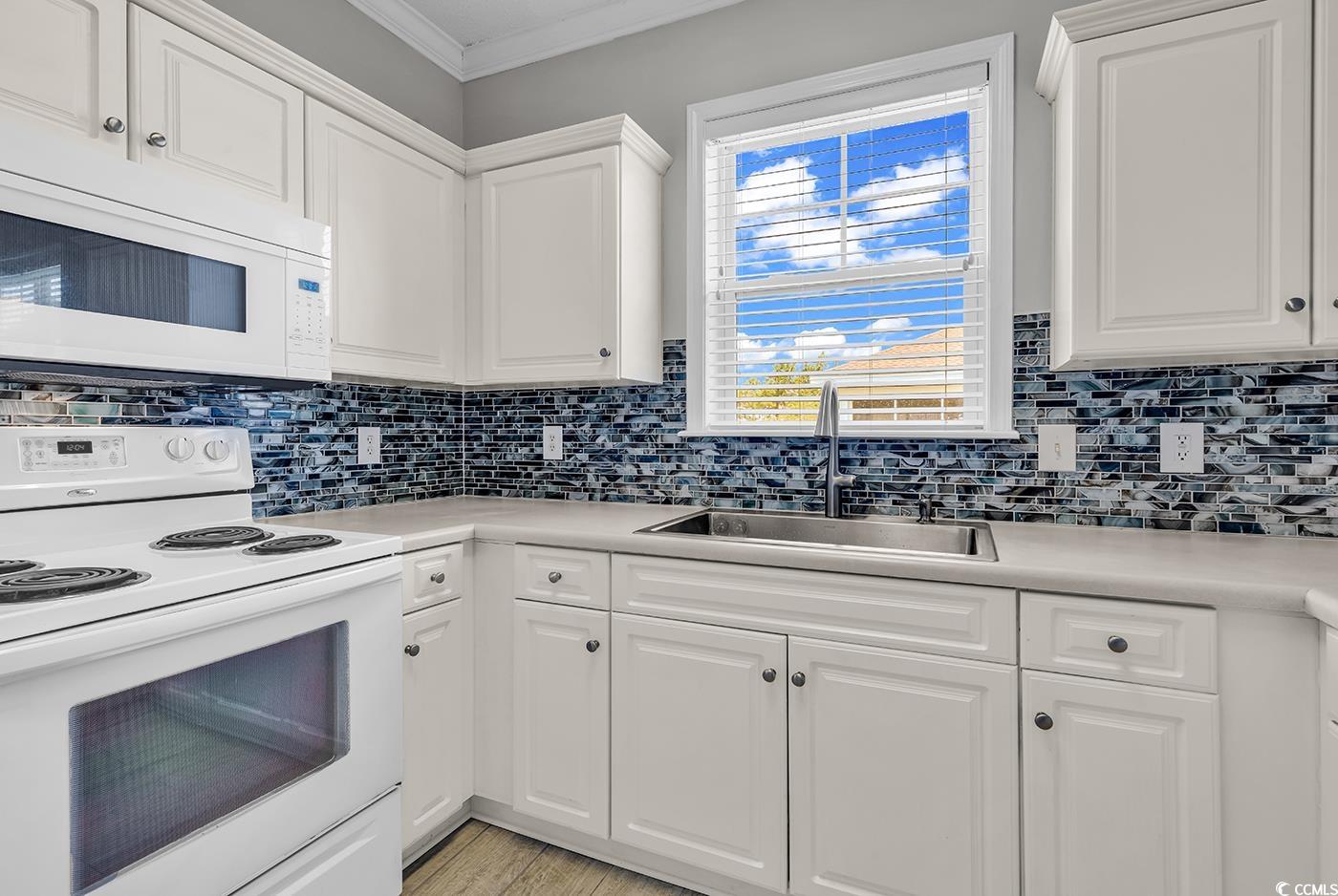 300 Kiskadee Loop, Unit K Conway, SC 29526 - Photo 3 of 40 Kitchen with white appliances, crown molding, ligh