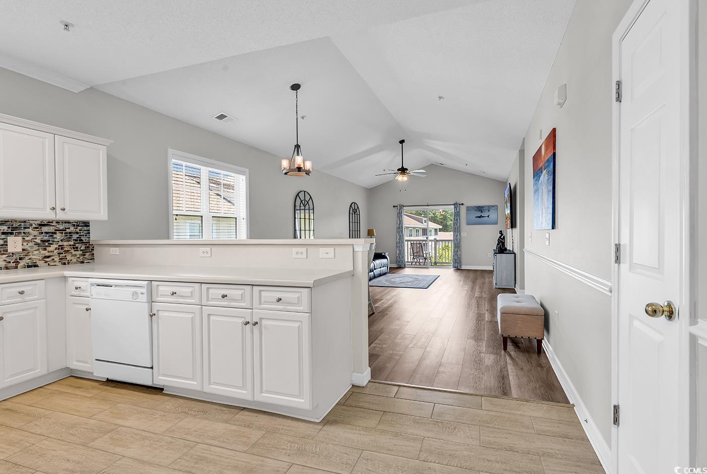 300 Kiskadee Loop, Unit K Conway, SC 29526 - Photo 4 of 40 Kitchen with dishwasher, vaulted ceiling, a penins