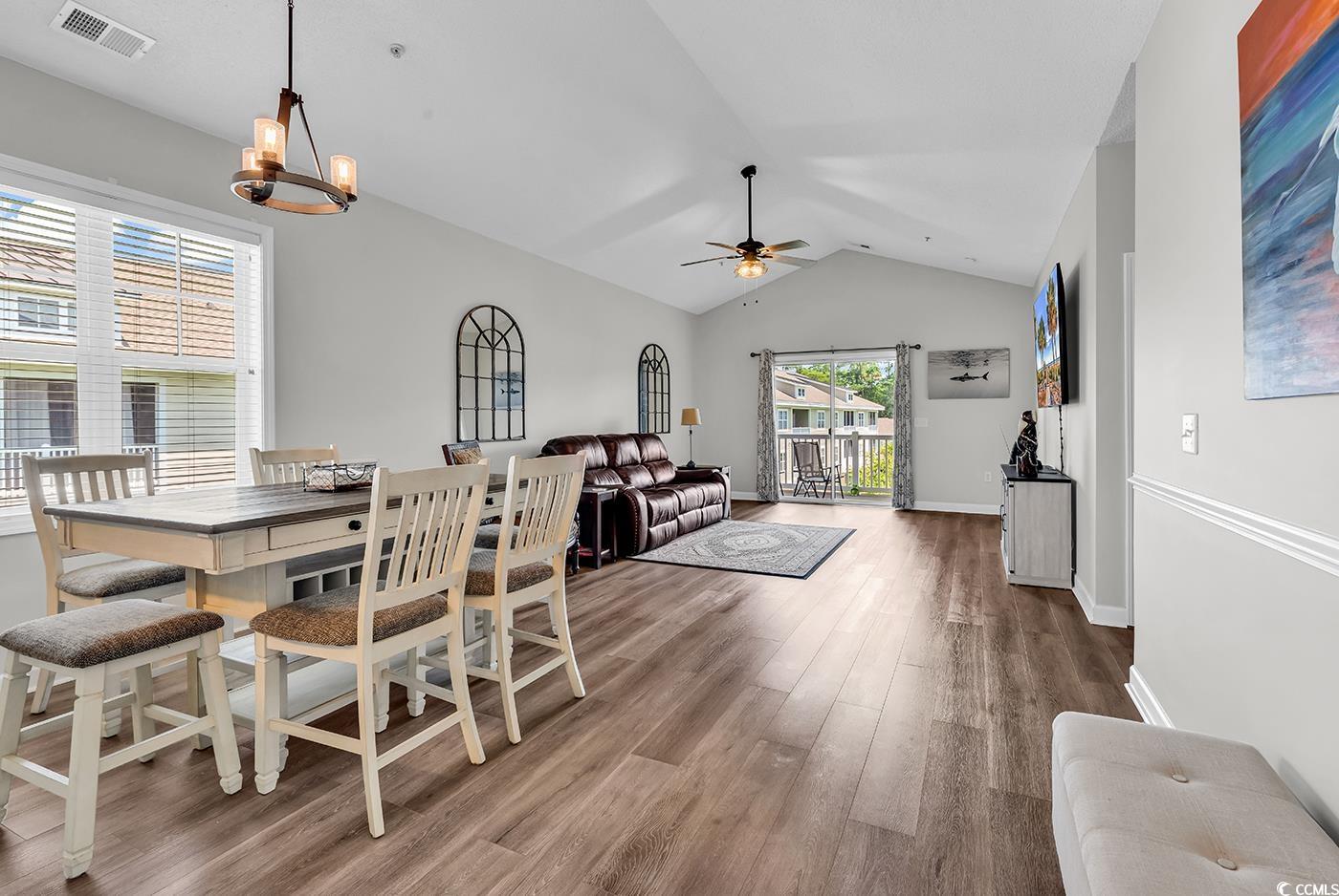 300 Kiskadee Loop, Unit K Conway, SC 29526 - Photo 5 of 40 Dining space with vaulted ceiling, wood finished f