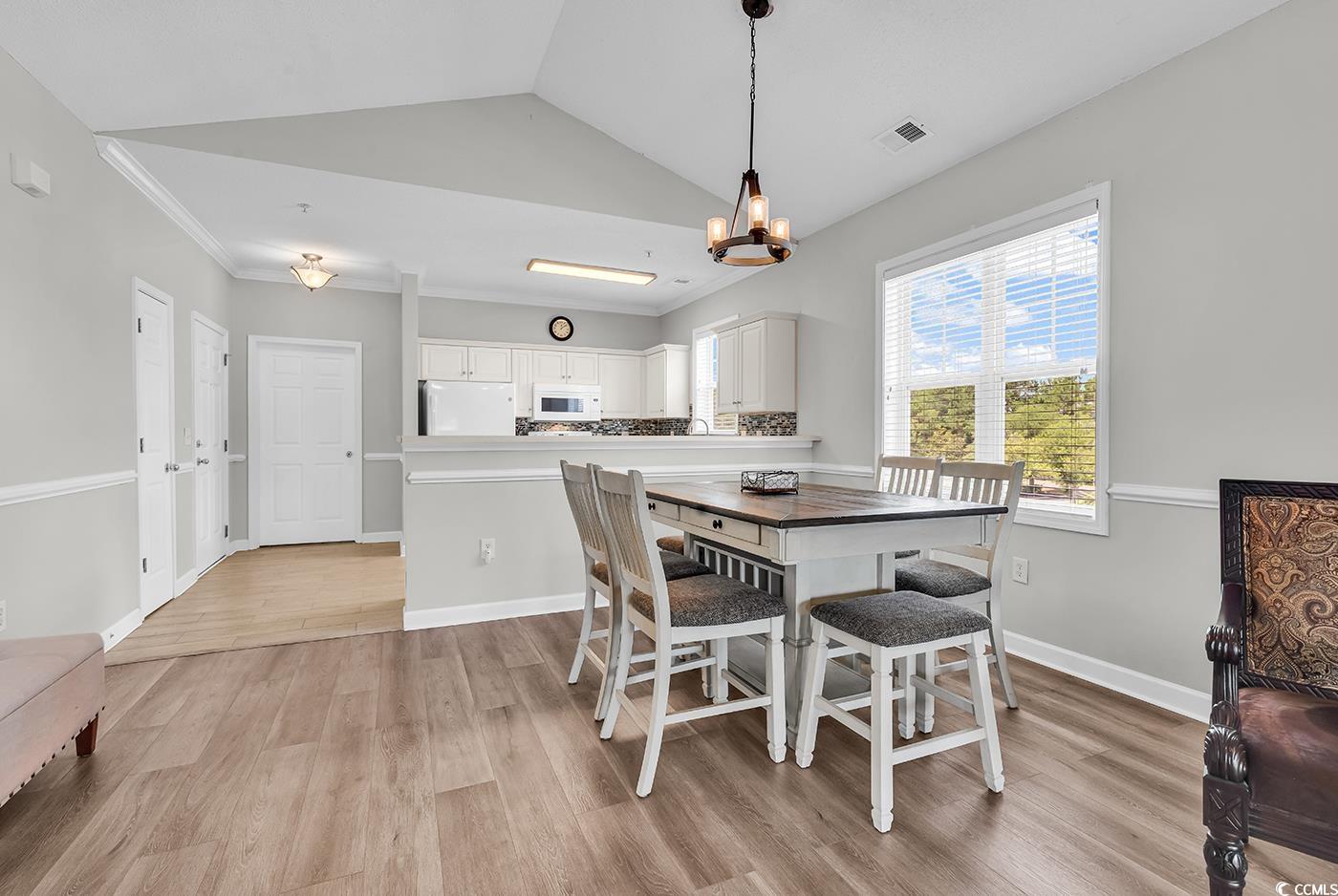 300 Kiskadee Loop, Unit K Conway, SC 29526 - Photo 6 of 40 Dining room featuring light wood-style flooring, a