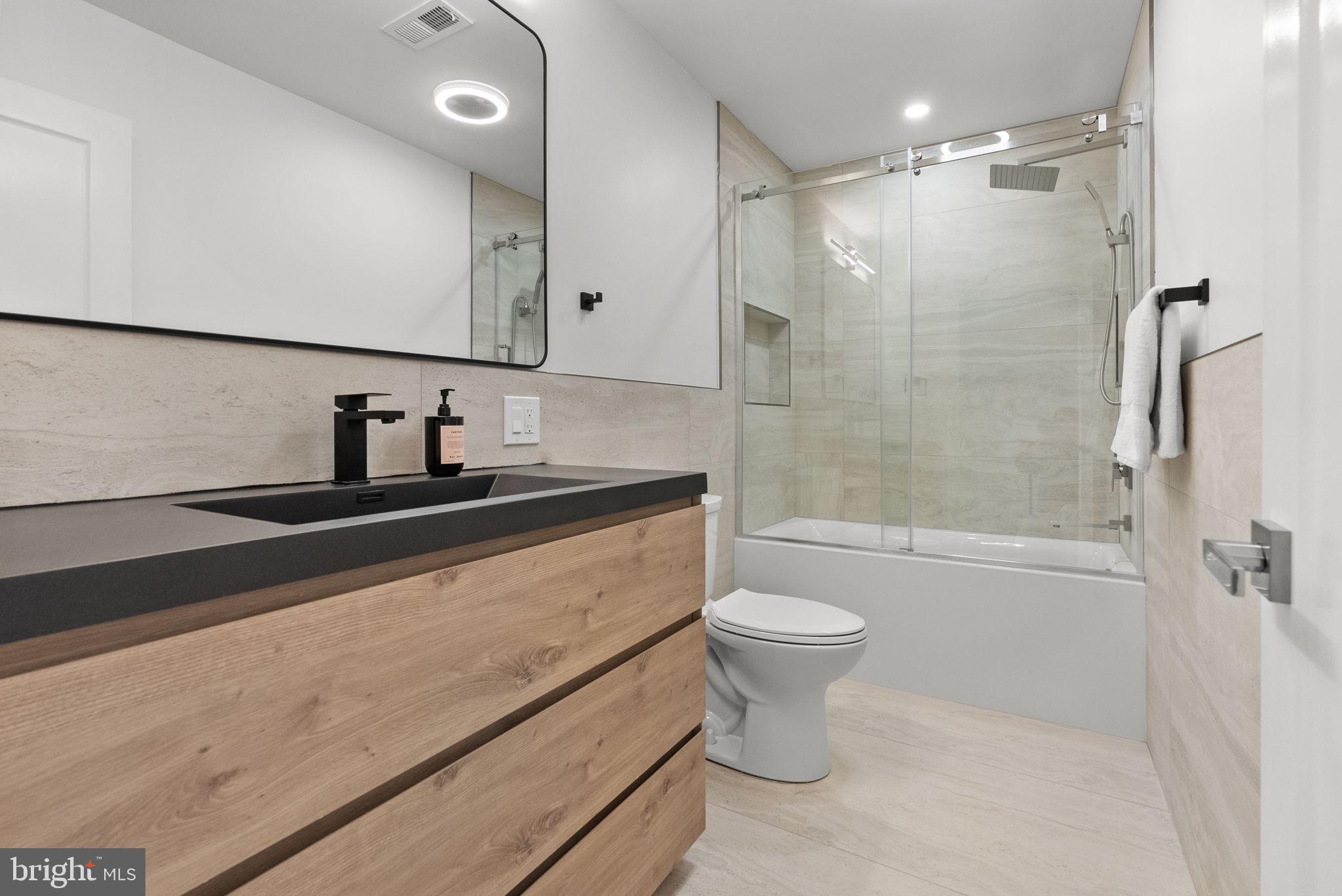 226 West Rittenhouse Street Philadelphia, PA 19144 - Photo 16 of 39 a bathroom with a sink a toilet and shower