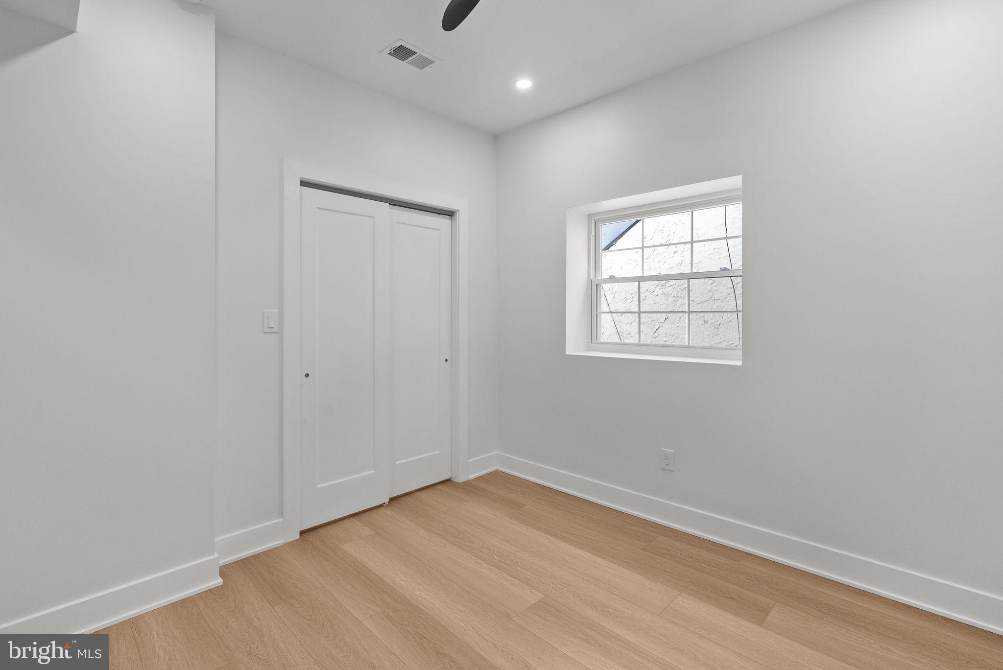 226 West Rittenhouse Street Philadelphia, PA 19144 - Photo 19 of 39 an empty room with wooden floor and windows