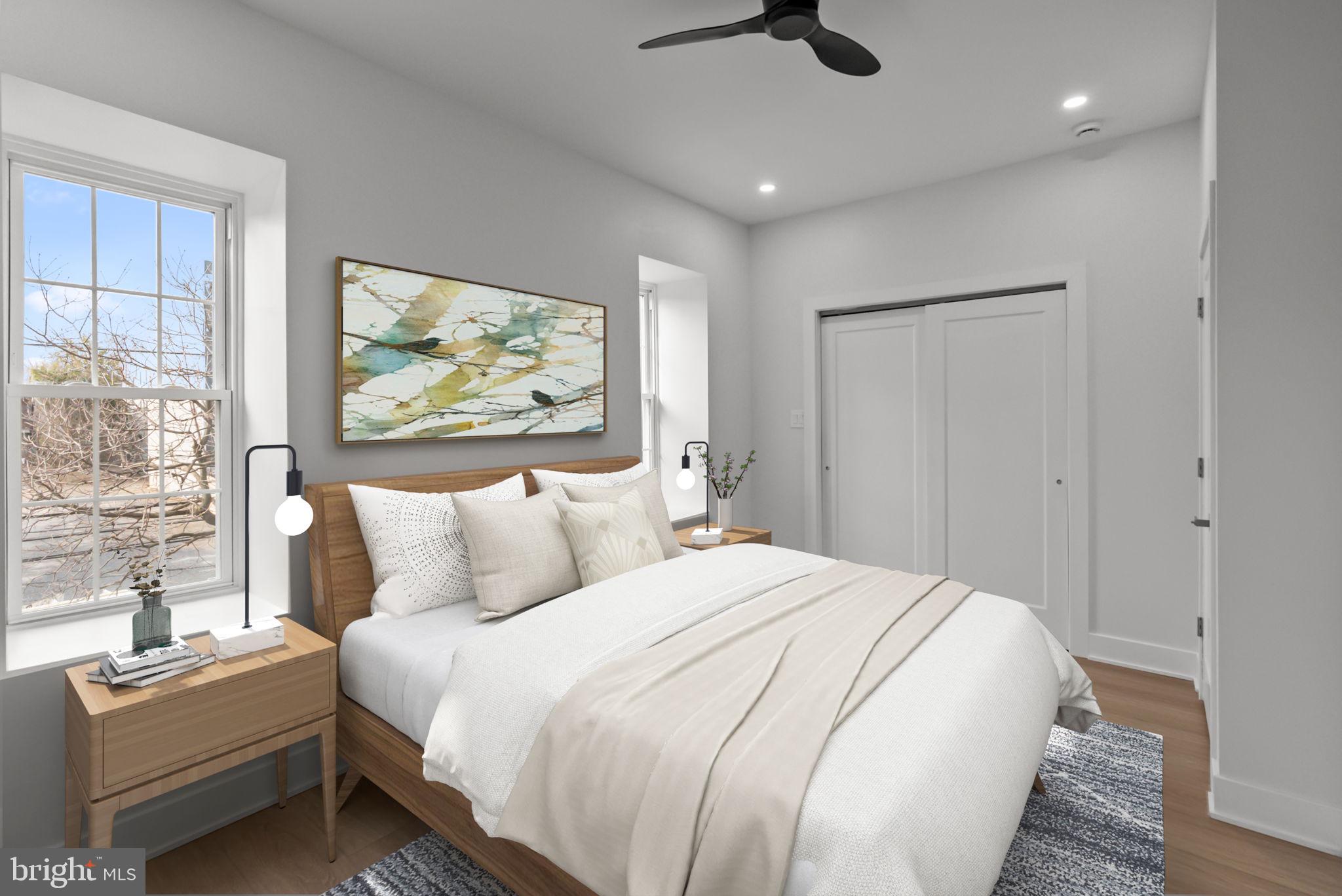 226 West Rittenhouse Street Philadelphia, PA 19144 - Photo 20 of 39 a bedroom with a bed and a painting on the wall