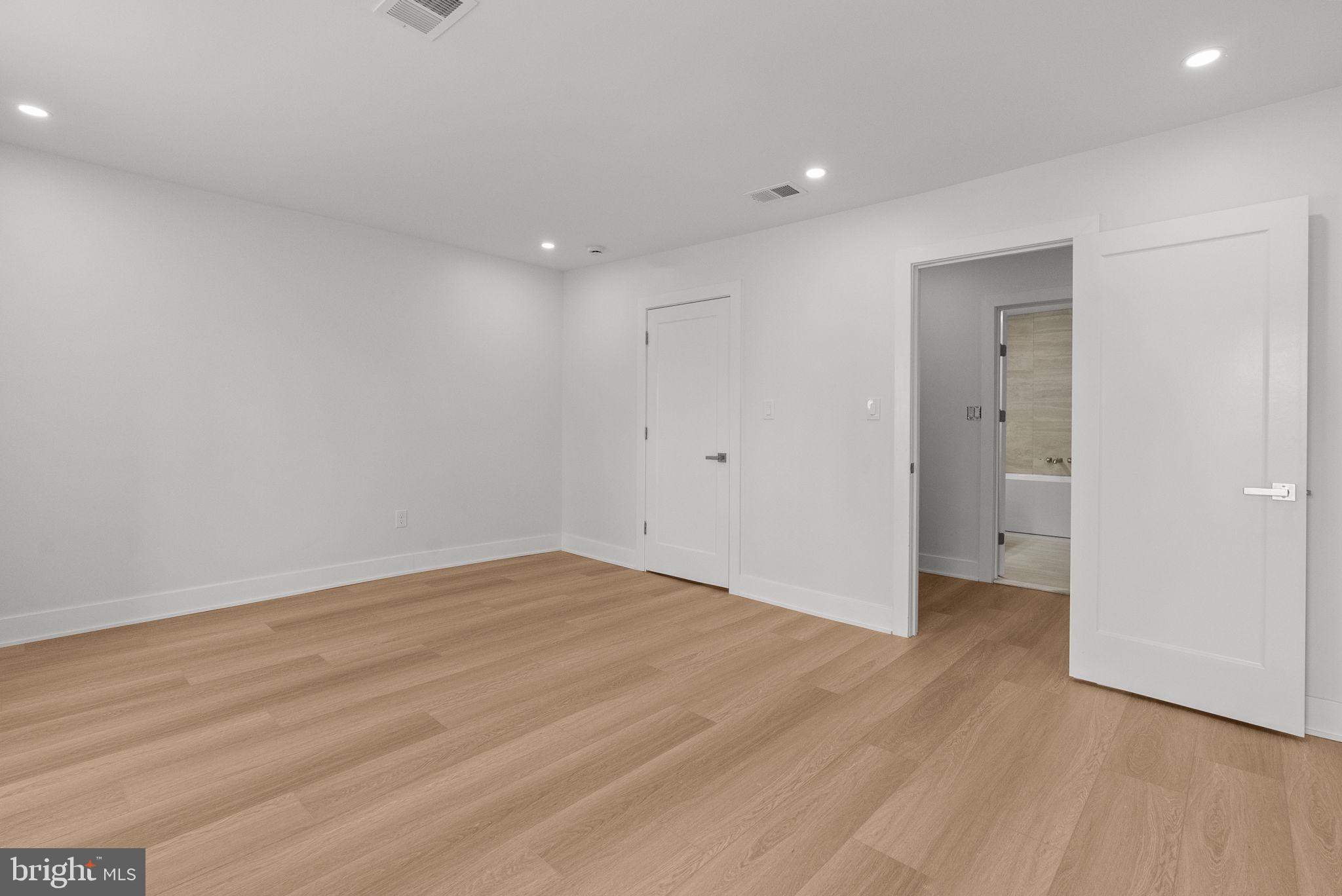 226 West Rittenhouse Street Philadelphia, PA 19144 - Photo 25 of 39 a view of an empty room with wooden floor and a window