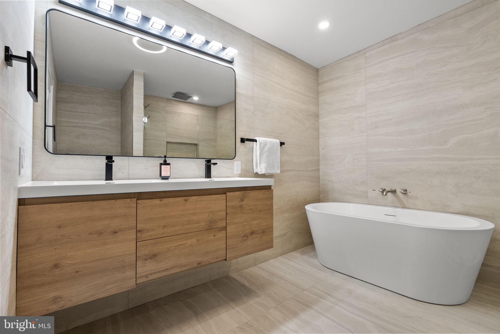 226 West Rittenhouse Street Philadelphia, PA 19144 - Photo 27 of 39 a bathroom with a double vanity sink mirror and bathtub