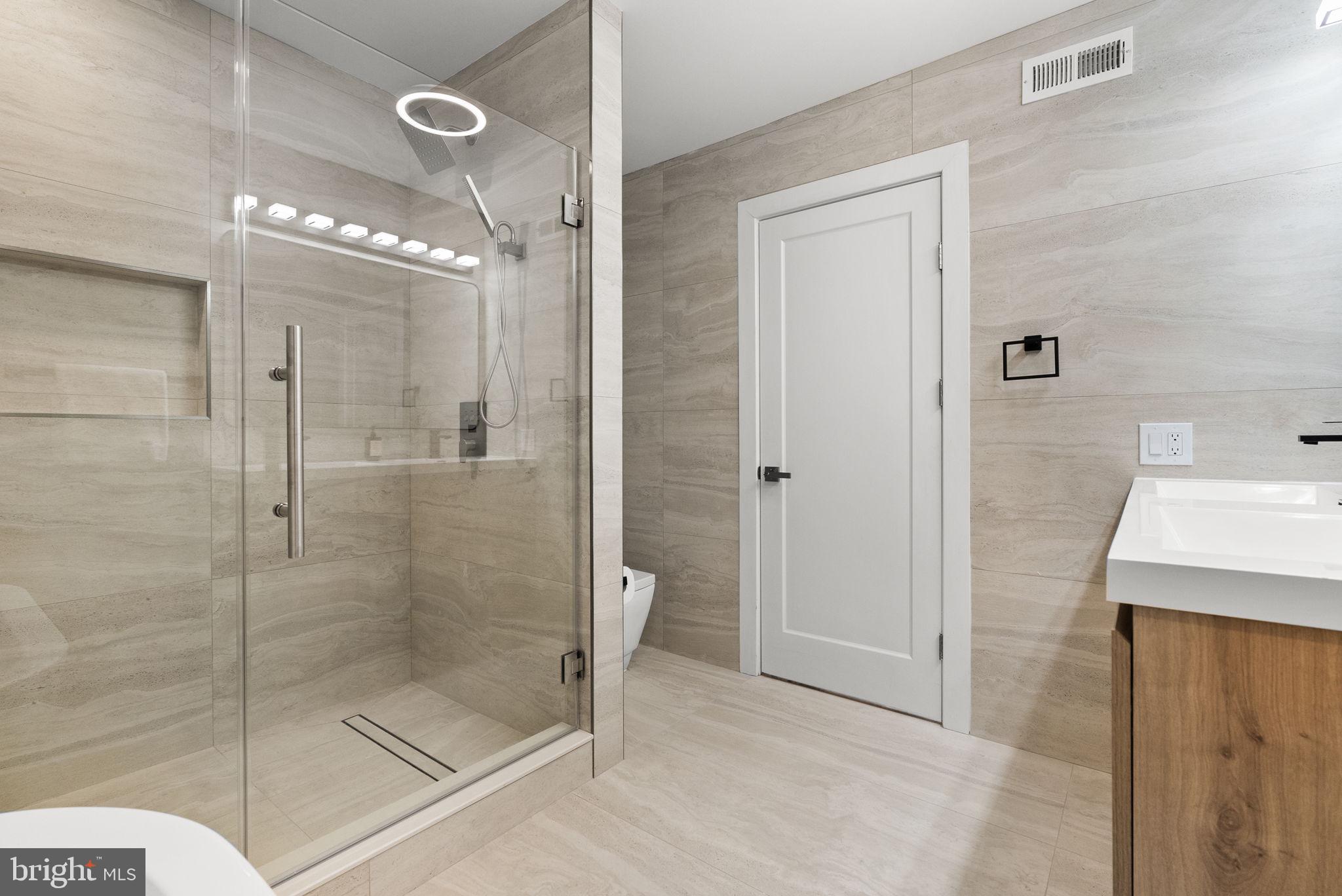 226 West Rittenhouse Street Philadelphia, PA 19144 - Photo 28 of 39 a bathroom with a shower and a sink