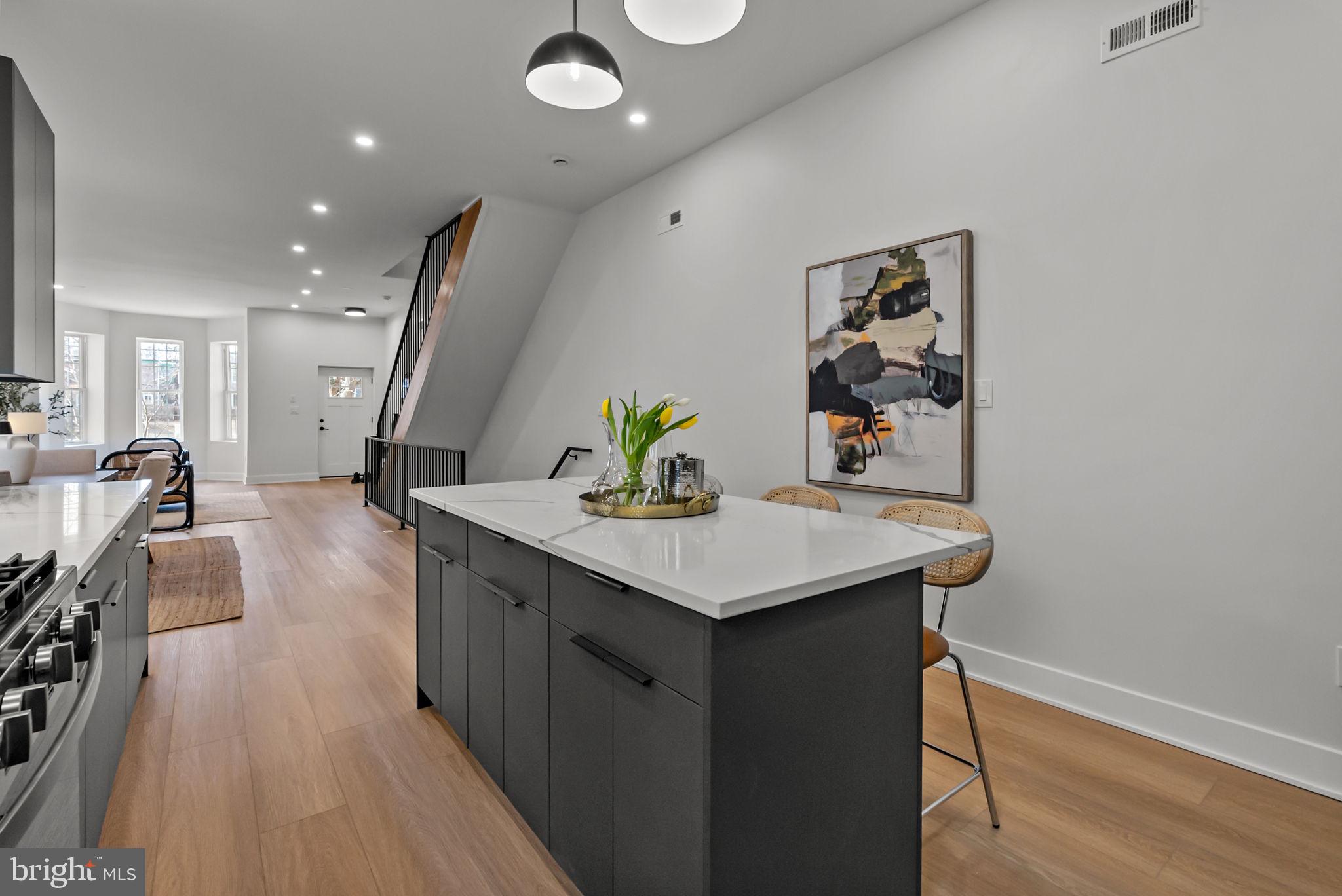 226 West Rittenhouse Street Philadelphia, PA 19144 - Photo 10 of 39 a kitchen with a sink a counter space and wooden floor
