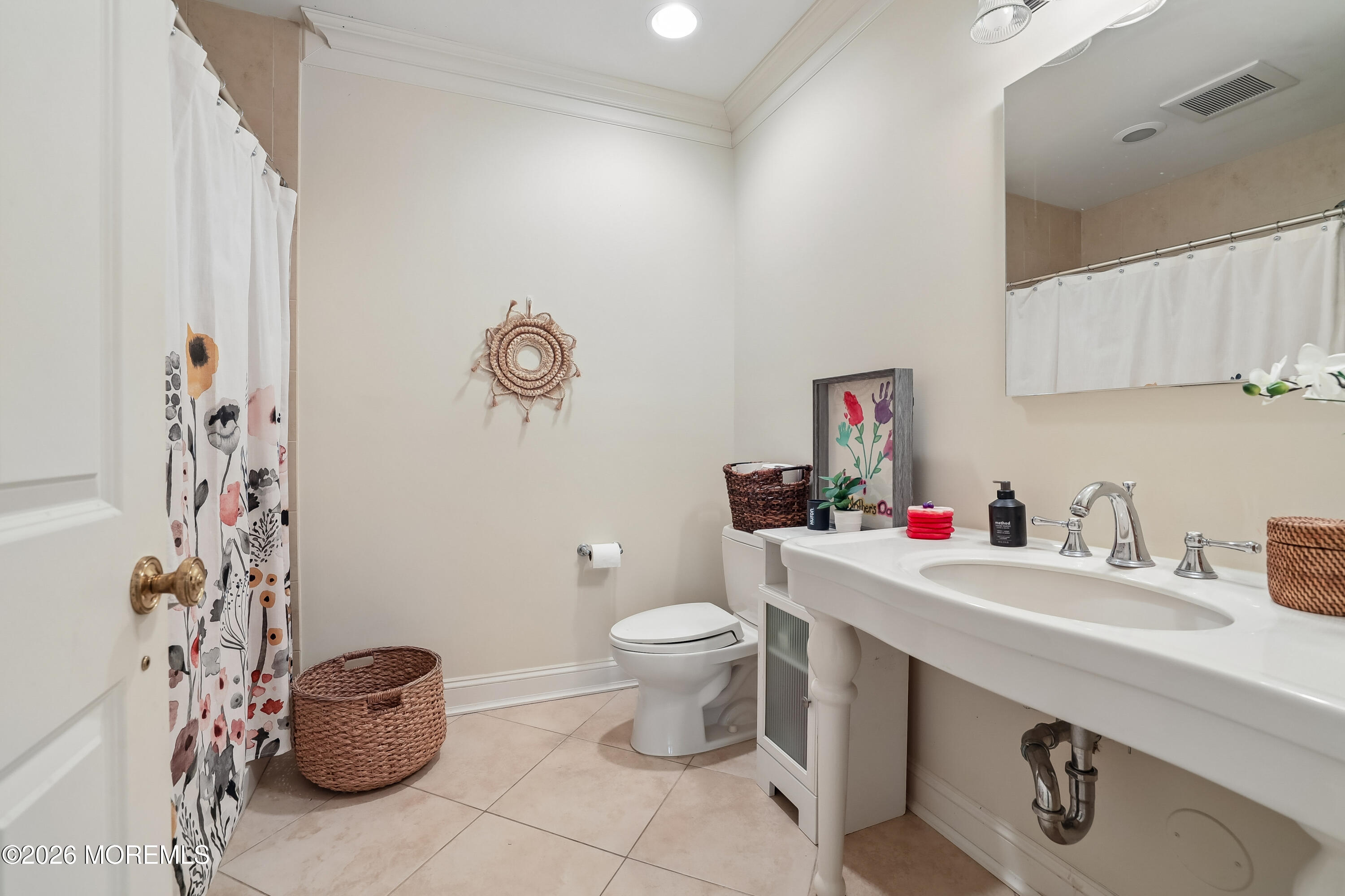 92 Tulip Lane Colts Neck, NJ 07722 - Photo 39 of 55 a bathroom with a sink a toilet and a mirror