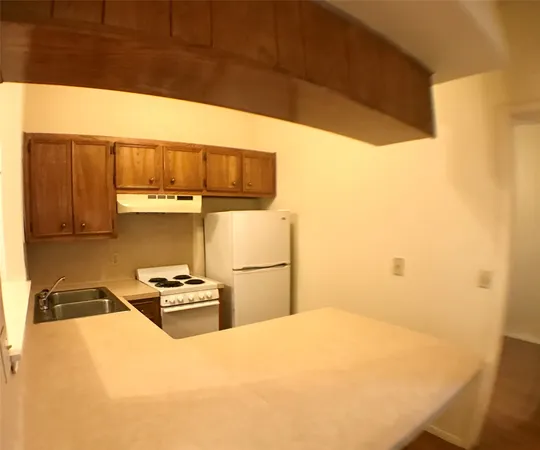 a bedroom with a bed and a cabinets