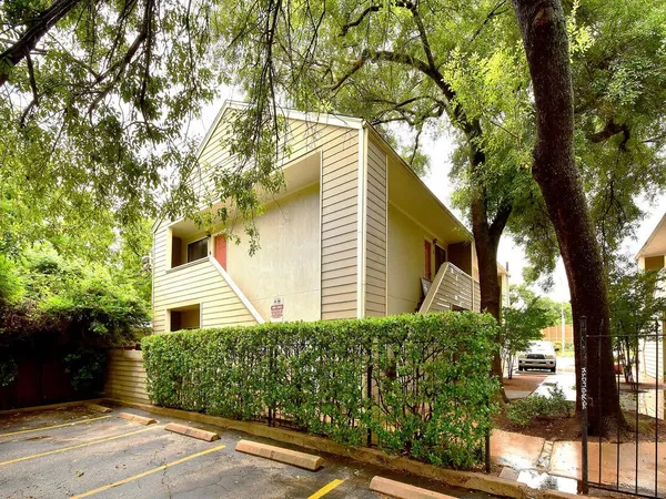 front view of a house with a tree