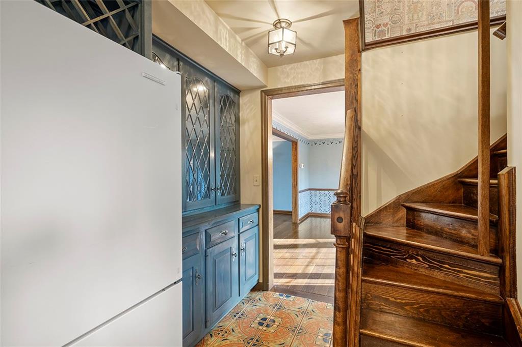 824 Flint Ridge Road Pittsburgh, PA 15243 - Photo 11 of 50 back staircase to 2nd floor laundry just off the kitchen/glass cabinets in the butler's pantry area