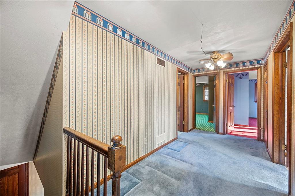 824 Flint Ridge Road Pittsburgh, PA 15243 - Photo 23 of 50 The upper hallway is designed not just as a pass-through, but as a spacious area that could easily serve as a room in itself.