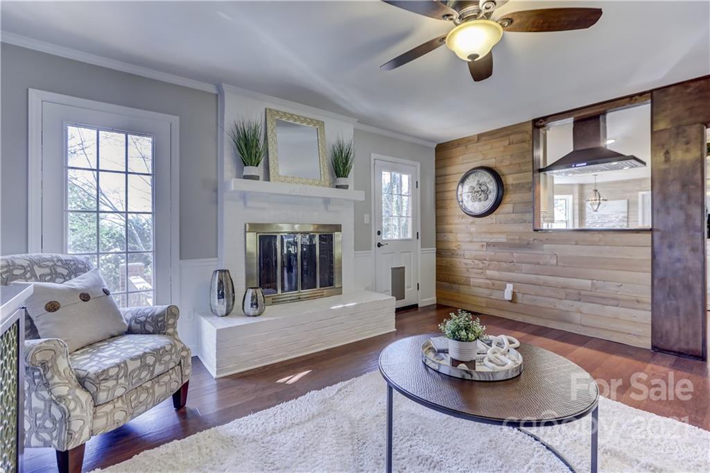 6601 Sharon Road Charlotte, NC 28210 - Photo 15 of 46 a living room with furniture and a fireplace
