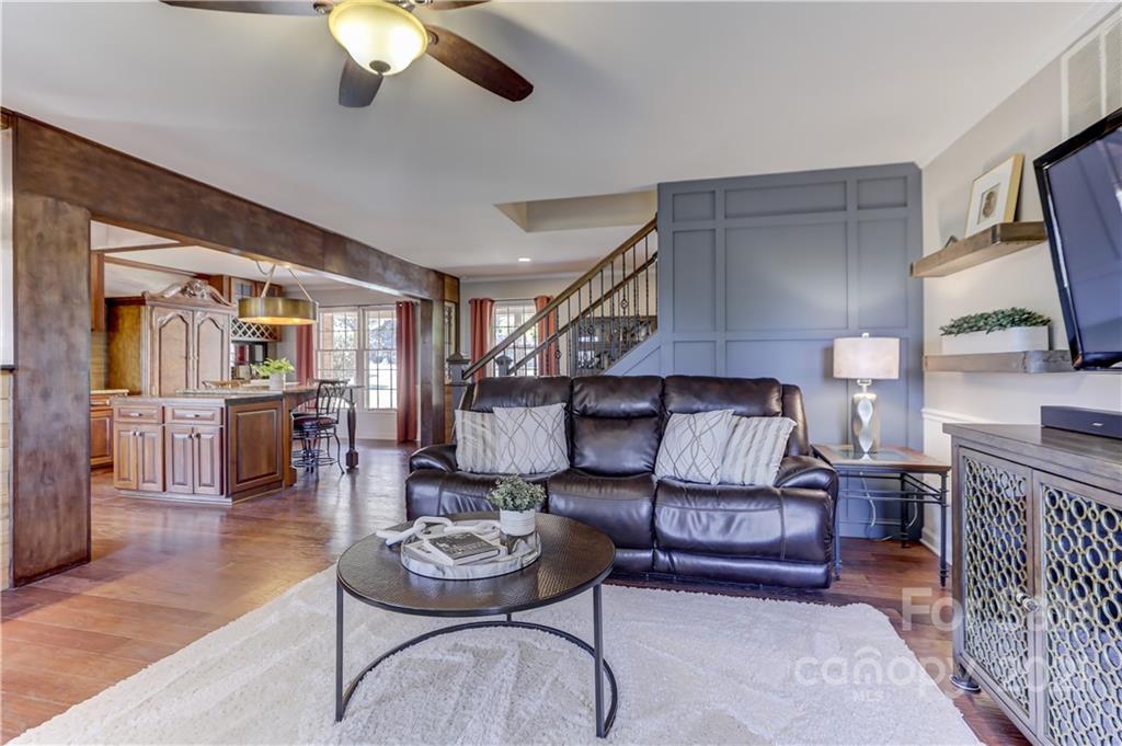 6601 Sharon Road Charlotte, NC 28210 - Photo 16 of 46 a living room with furniture and a wooden floor