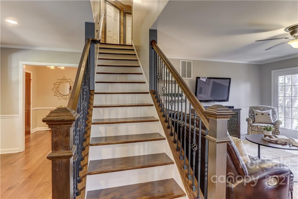 6601 Sharon Road Charlotte, NC 28210 - Photo 29 of 46 a view of entryway and hall with wooden floor
