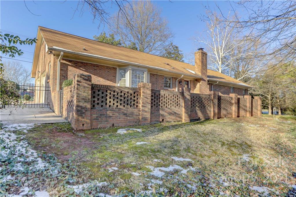 6601 Sharon Road Charlotte, NC 28210 - Photo 42 of 46 a view of a house with a yard