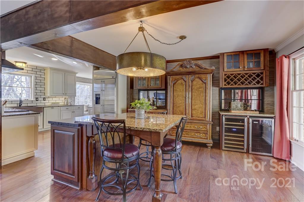 6601 Sharon Road Charlotte, NC 28210 - Photo 5 of 46 a view of a dining room with furniture window and wooden floor