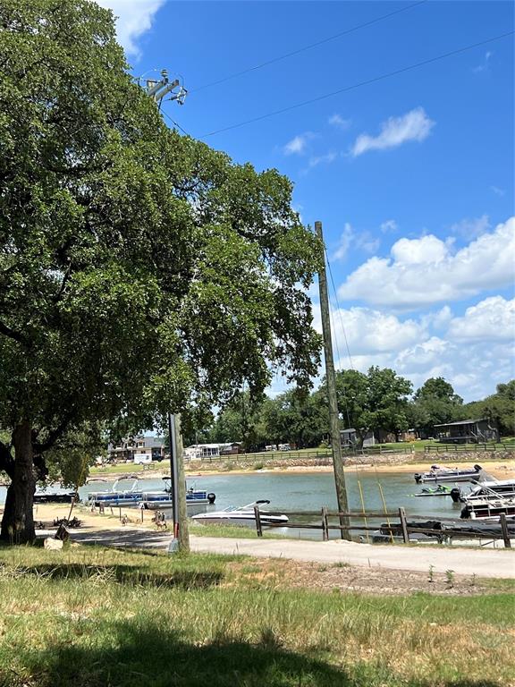 2334 San Bar Road, Unit 46 Graford, TX 76449 - Photo 31 of 37 a view of a yard with large trees