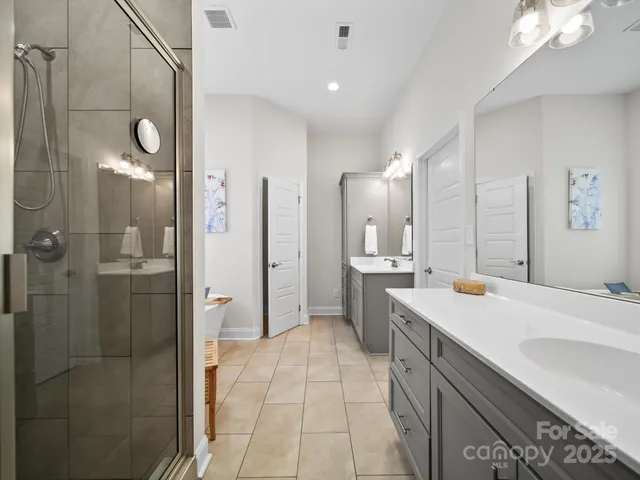 a kitchen with a sink a refrigerator and a counter top space