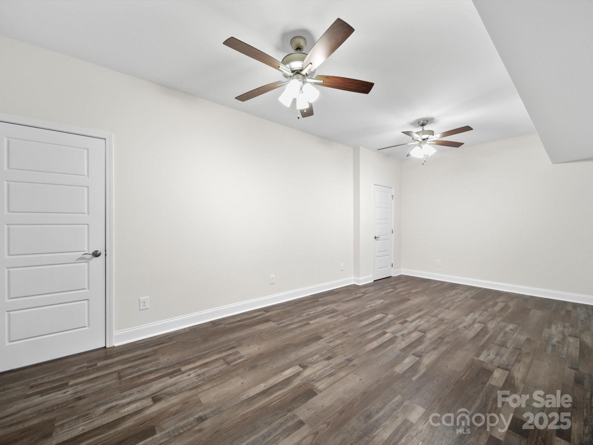 1421 Hamilton Crossroads Road Marshville, NC 28103 - Photo 18 of 29 a view of an empty room with a ceiling fan