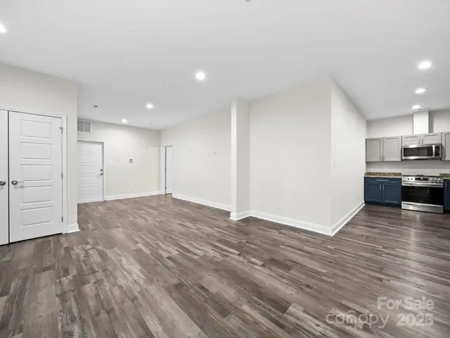 a view of a kitchen with a sink and a stove top oven
