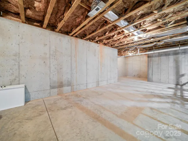 a view of a room with wooden walls