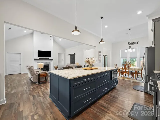 a view of kitchen center island and living room