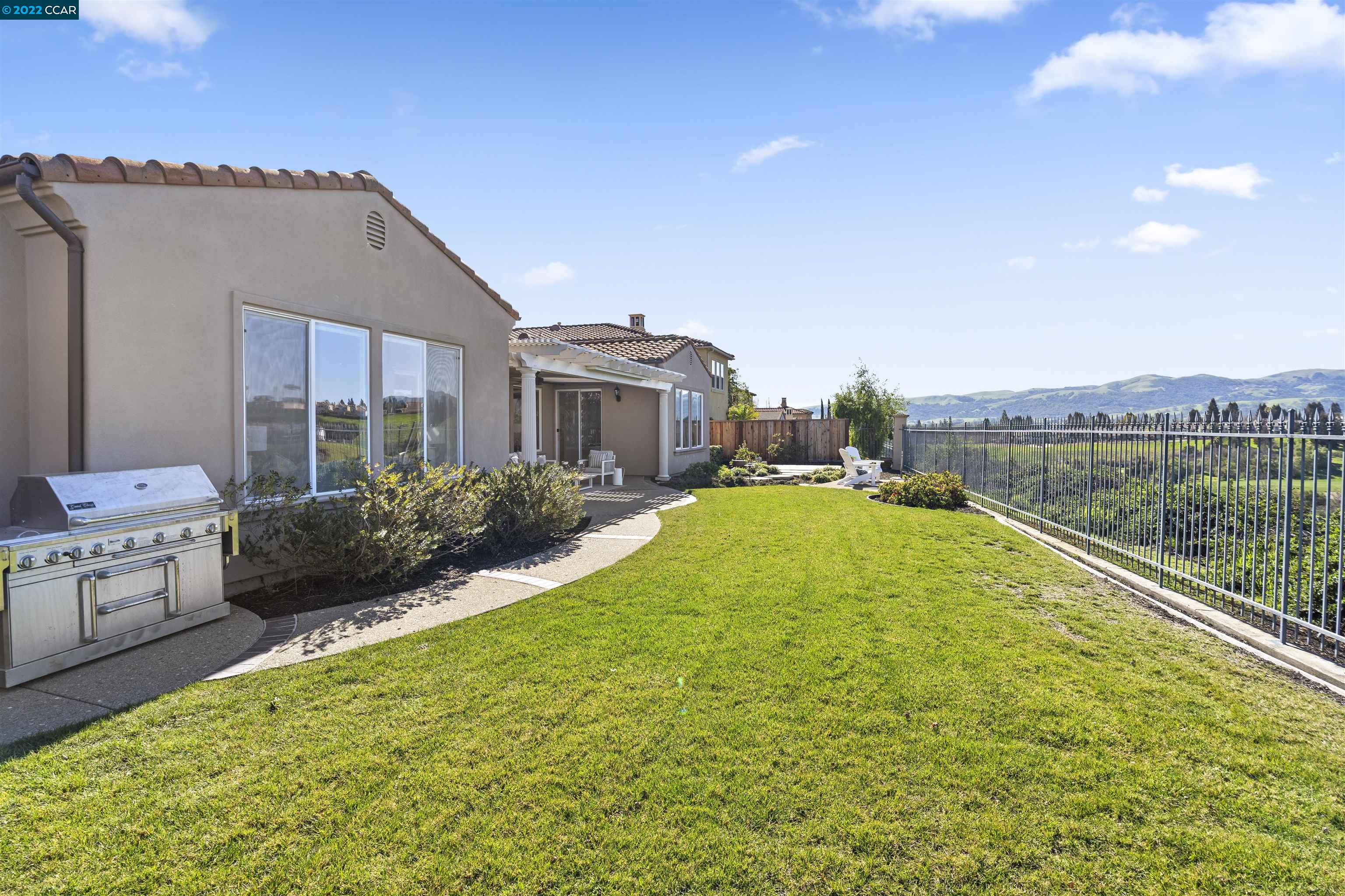 9548 Velvetleaf Circle San Ramon, CA 94582 - Photo 2 of 13 a view of swimming pool with outdoor seating and house in the background