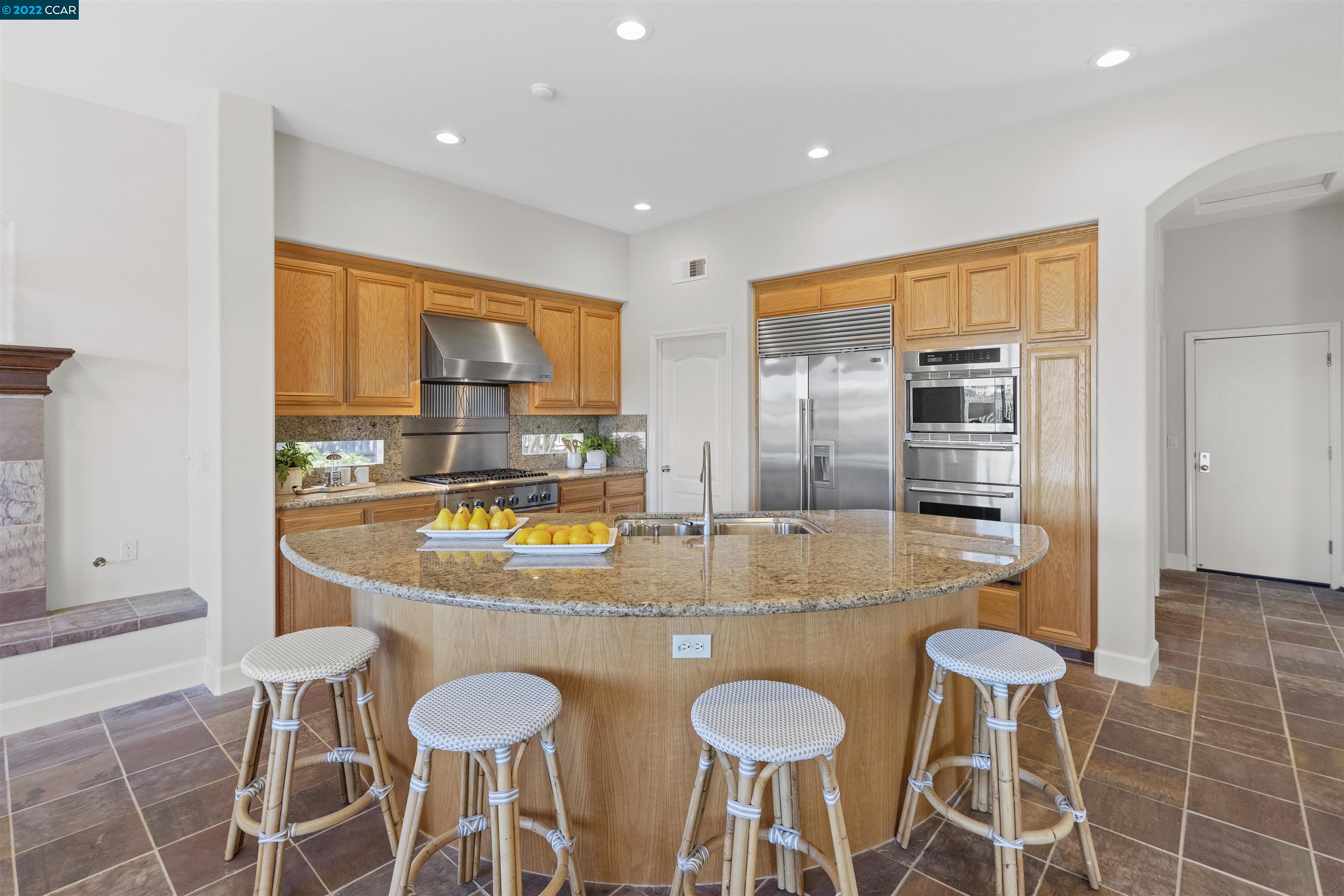 9548 Velvetleaf Circle San Ramon, CA 94582 - Photo 7 of 13 a view of a kitchen with granite countertop dining room cabinets and stainless steel appliances