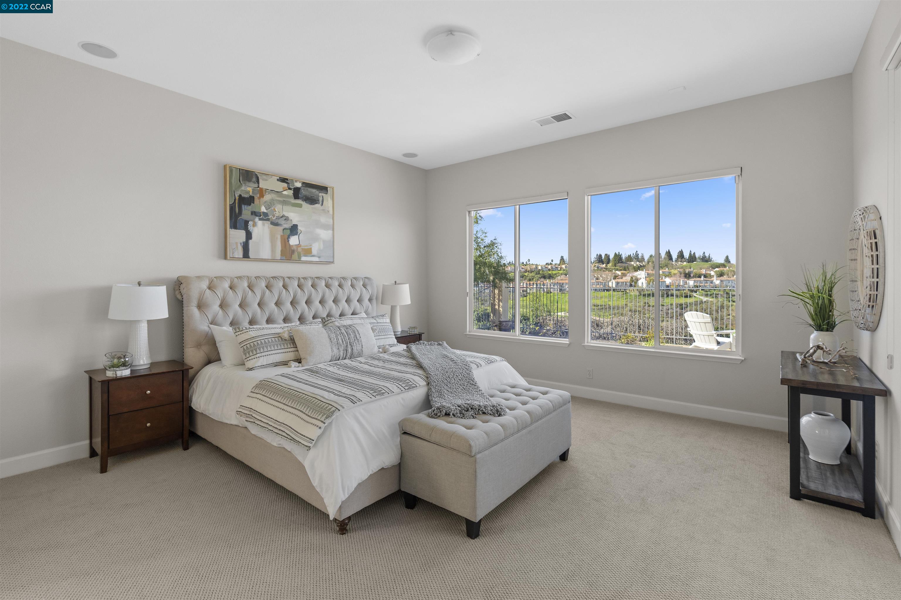 9548 Velvetleaf Circle San Ramon, CA 94582 - Photo 10 of 13 a spacious bedroom with a bed and a window