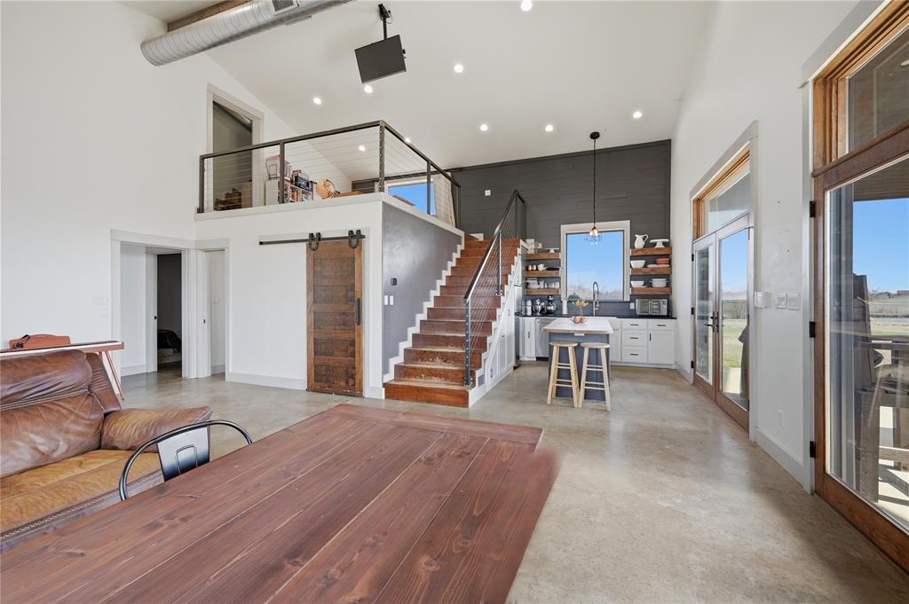 140 Turkey Farm Road Whitesboro, TX 76273 - Photo 11 of 38 a view of a livingroom with furniture and stairs