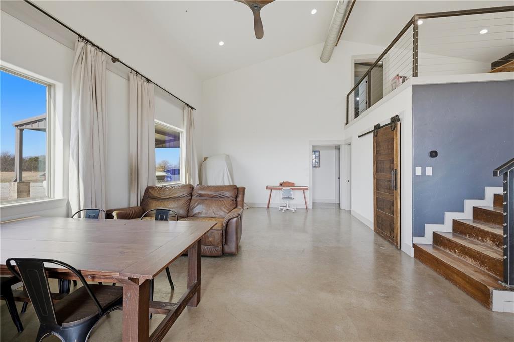 140 Turkey Farm Road Whitesboro, TX 76273 - Photo 15 of 38 a dining room with furniture and wooden floor