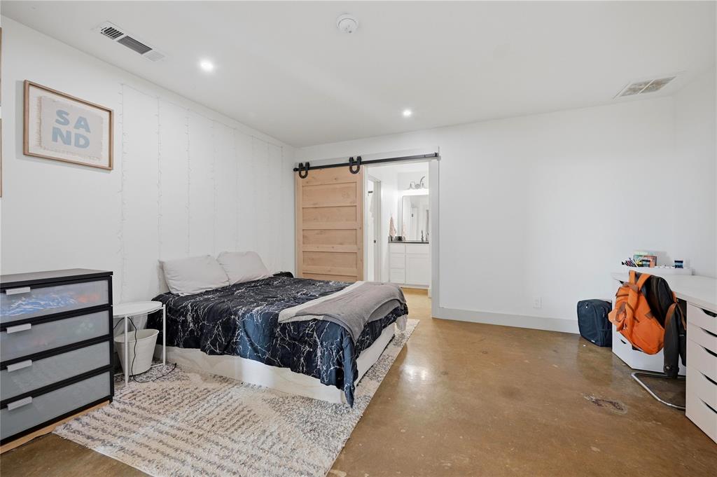 140 Turkey Farm Road Whitesboro, TX 76273 - Photo 23 of 38 a bedroom with a bed and a walk in closet