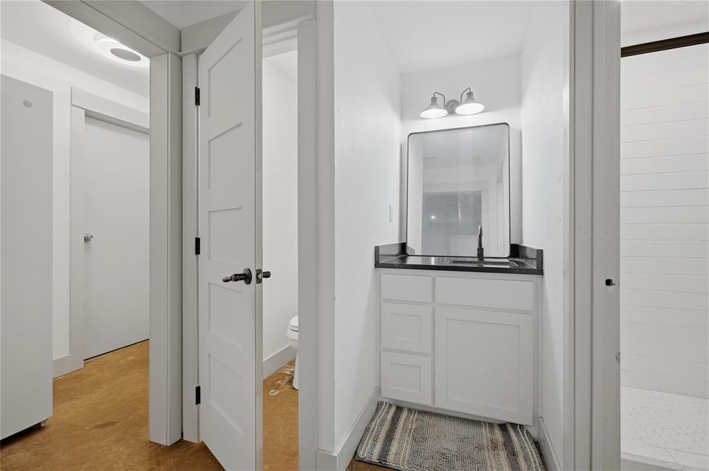 140 Turkey Farm Road Whitesboro, TX 76273 - Photo 29 of 38 a bathroom with a sink and mirror