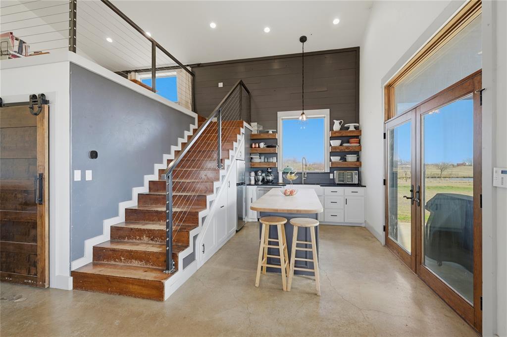 140 Turkey Farm Road Whitesboro, TX 76273 - Photo 7 of 38 a room with stairs and a furniture